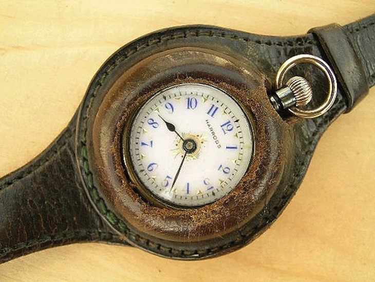 Harrods early wrist watch comprising a pocket watch and additional leather strap. Source: vintage-watches-collection.com