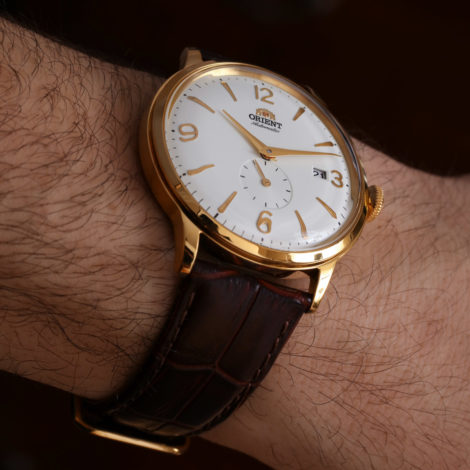 Orient Bambino Small Seconds gold tone side on wrist