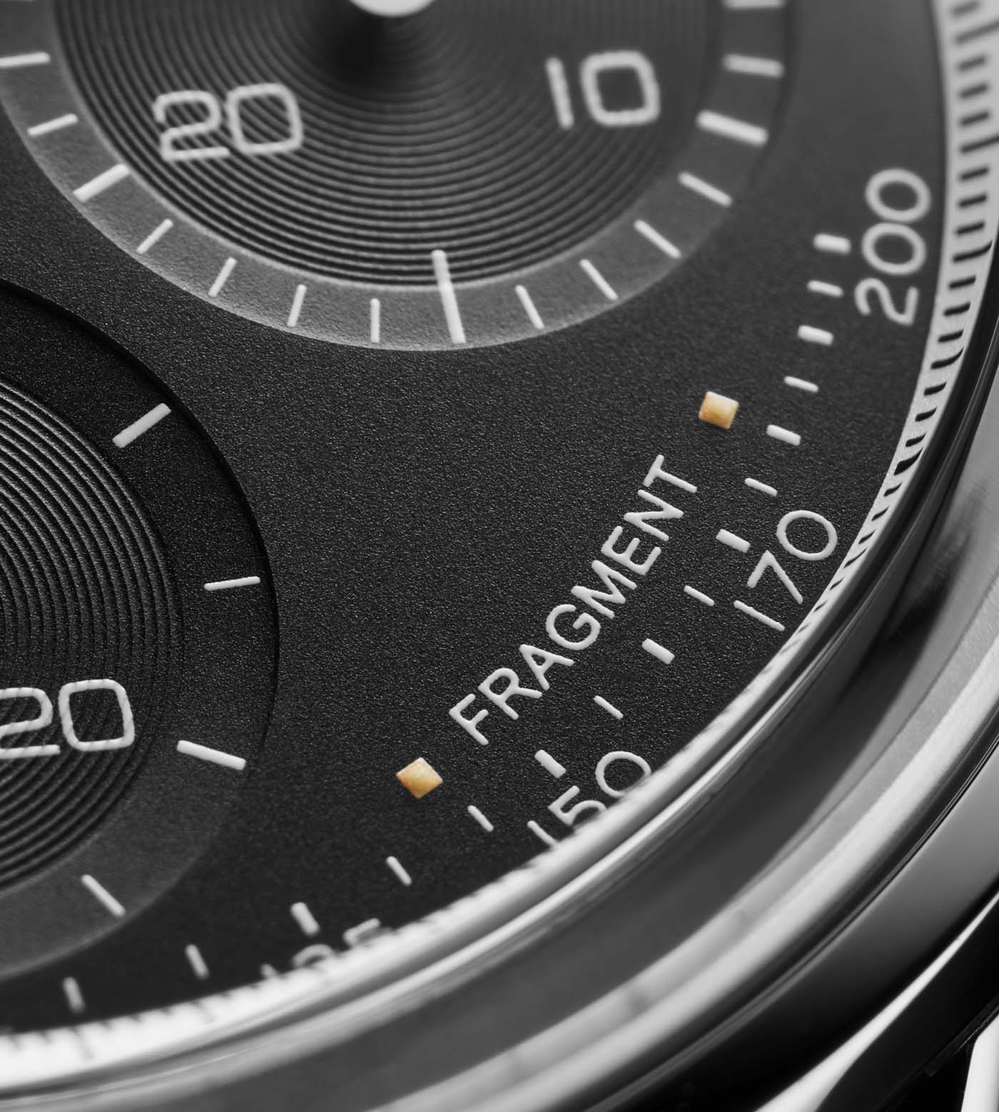 The fragment branding on the dial of the TAG Heuer Carrera Heuer 02 Fragment Limited Edition watch by Hiroshi Fujiwara