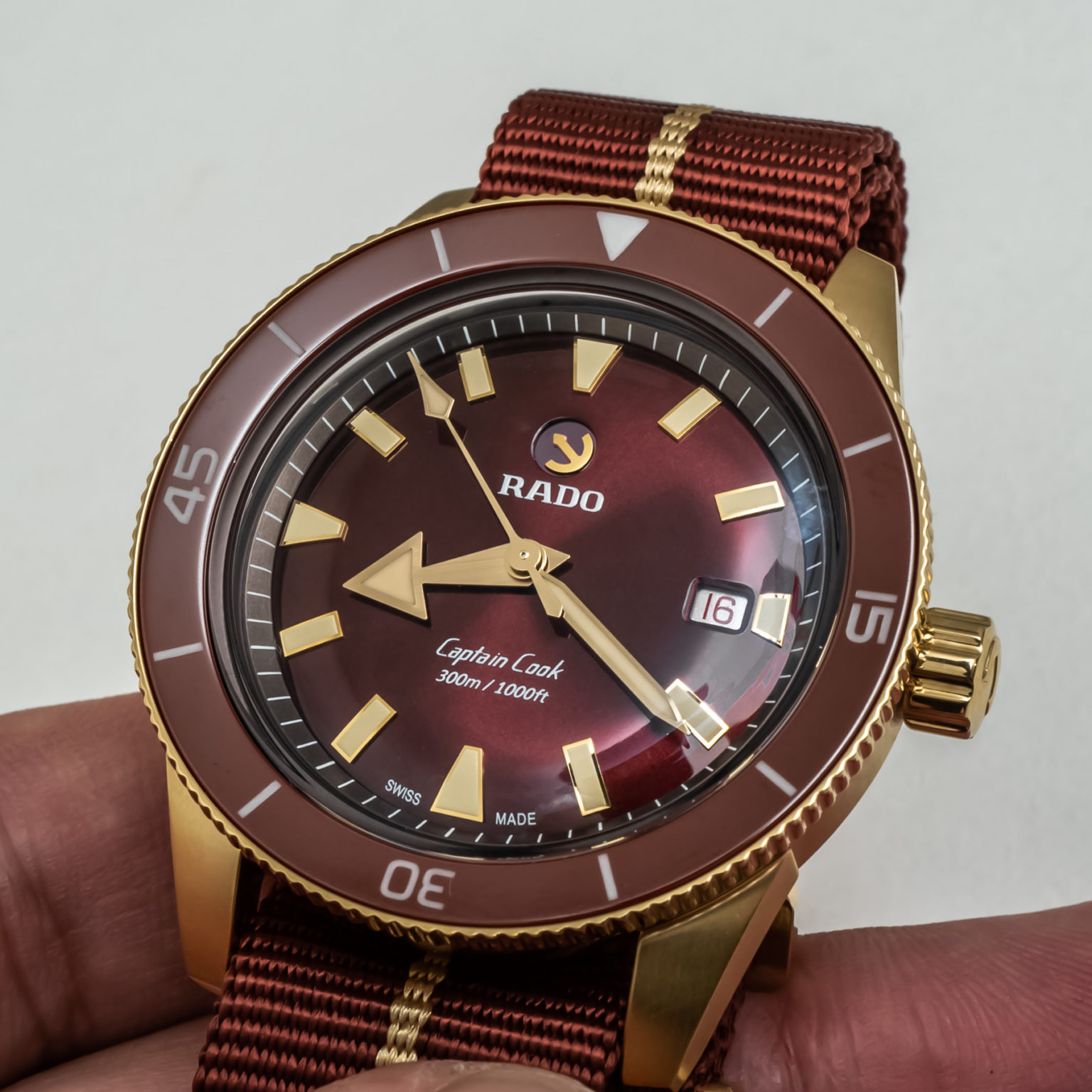 Rado Adds Extra Warmth To Bronze With The Captain Cook Bronze Burgundy ...